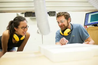 staff demonstrating a CNC router