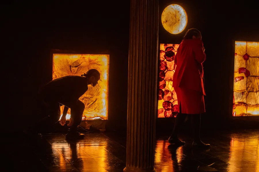 two figure in darkened space